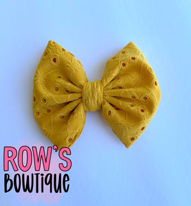 Yellow eyelet bow