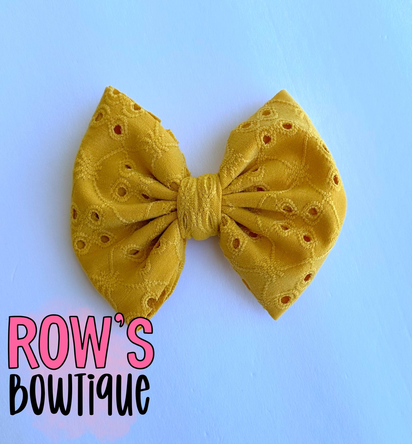 Yellow eyelet bow